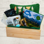 golf box with book, pillow and other items