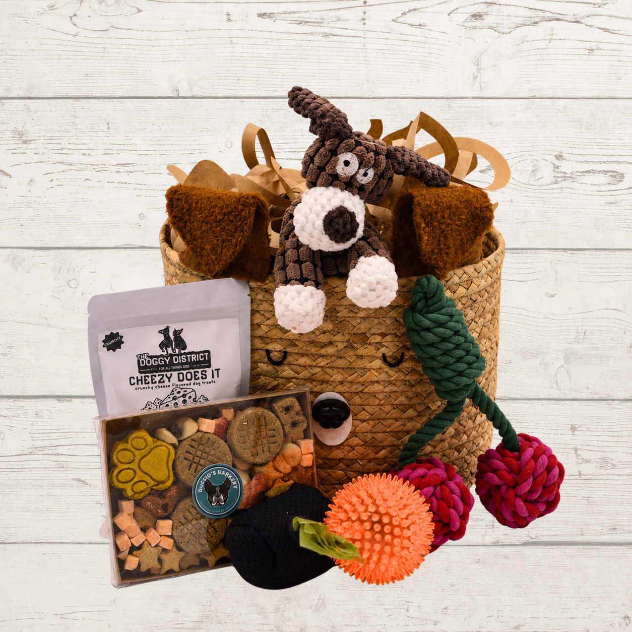 basket with dog treats and toys