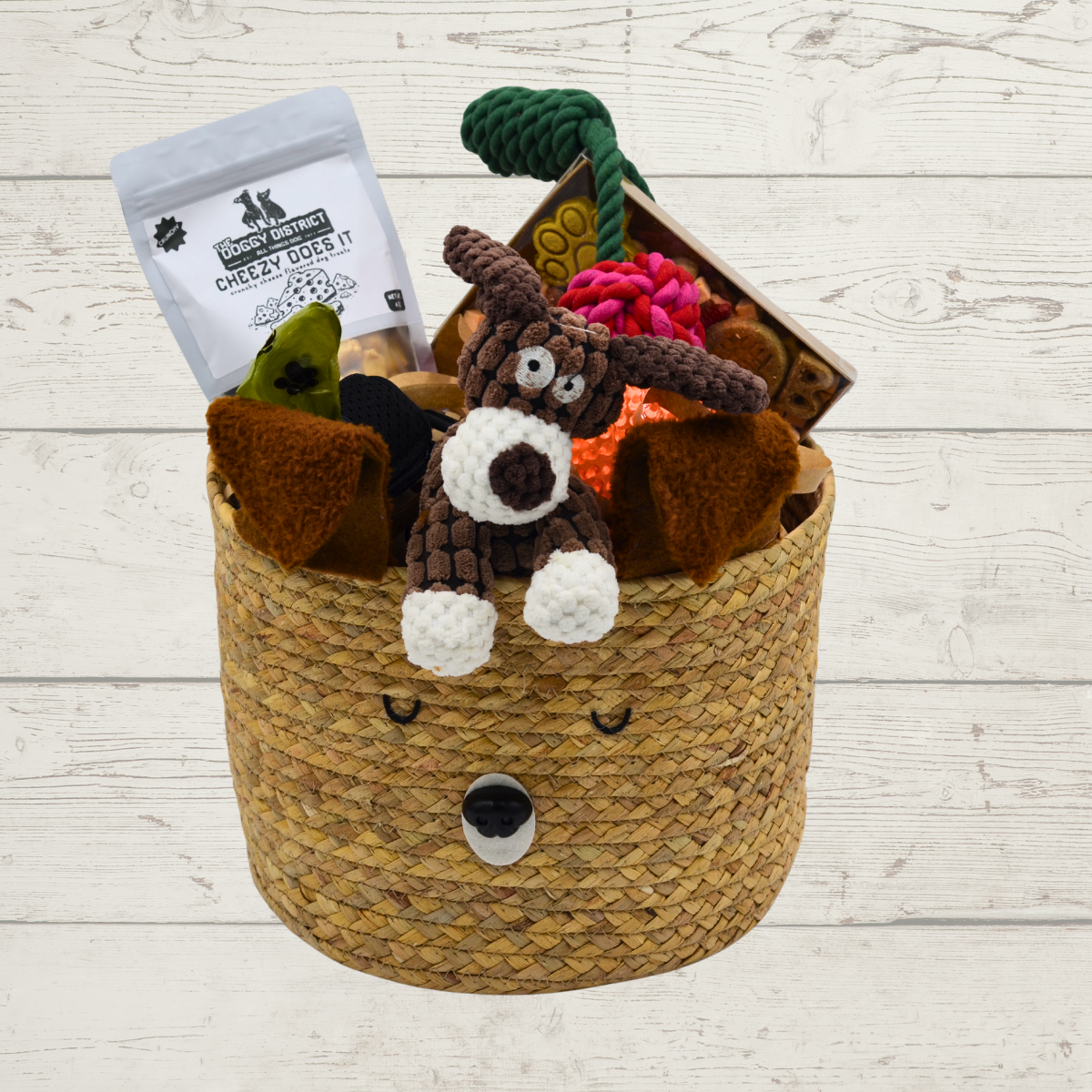 basket with dog treats and toys