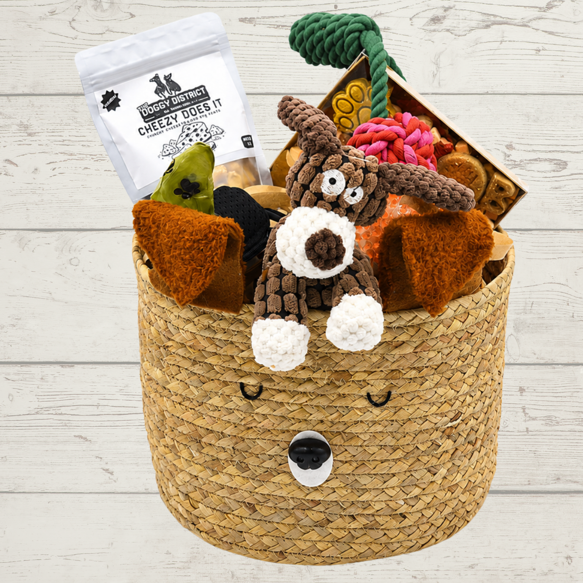 basket with dog treats and toys